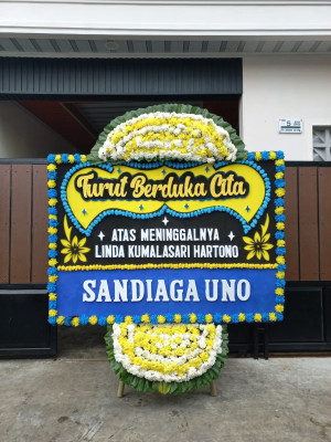 Papan Bunga Duka di Pagar Merbau